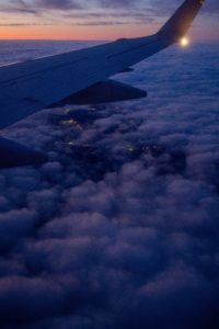 Image of aircraft wing against dusk sky