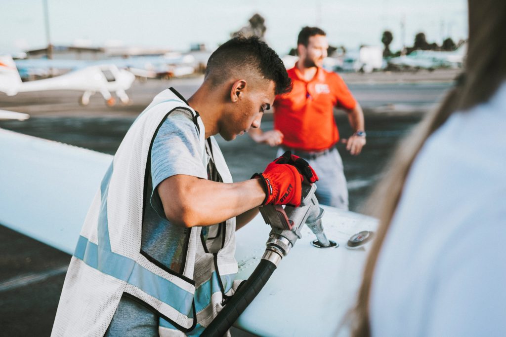 Person refueling aircraft