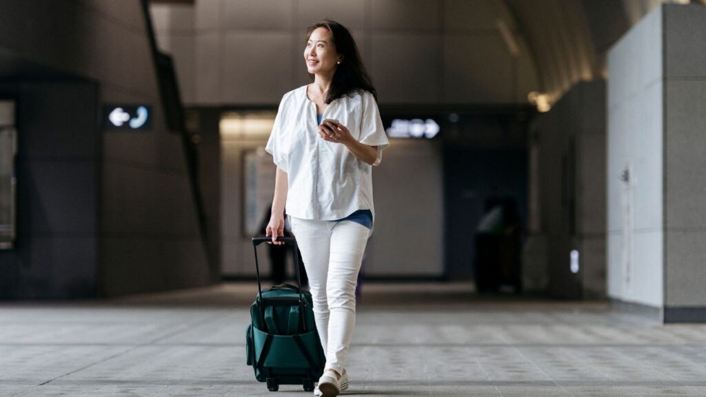 Woman with Luggage bag in airport